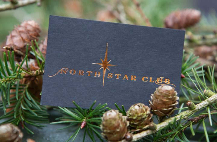 north star club luxury woodland retreat holidays - business card with branding