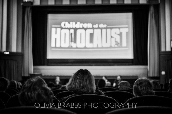 black and white image showing audience viewing film premiere of Children of the Holocaust by Fettle Animation