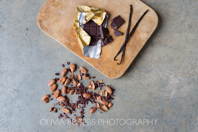 flay lay photograph for choc affair showing raw ingredients and dark chocolate bar