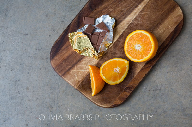 food photography shoot image for choc affair showing chocolate orange bar with raw orange