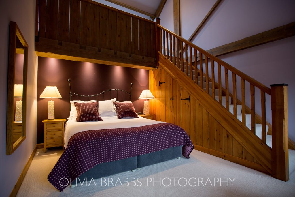 interiors photography showing bedroom in luxury country cottage