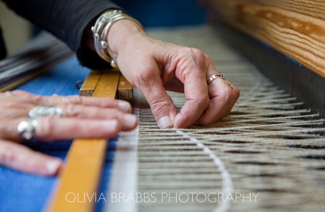 detail image of hands weaving