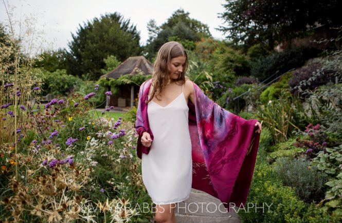 model portrait showcasing meiji designs silk scarf shot in gardens at Grays Court York