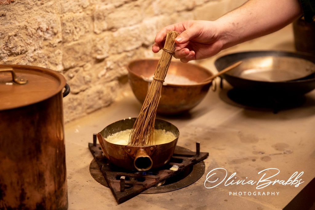 demonstration of georgian cooking techniques in kitchen at york mansion house