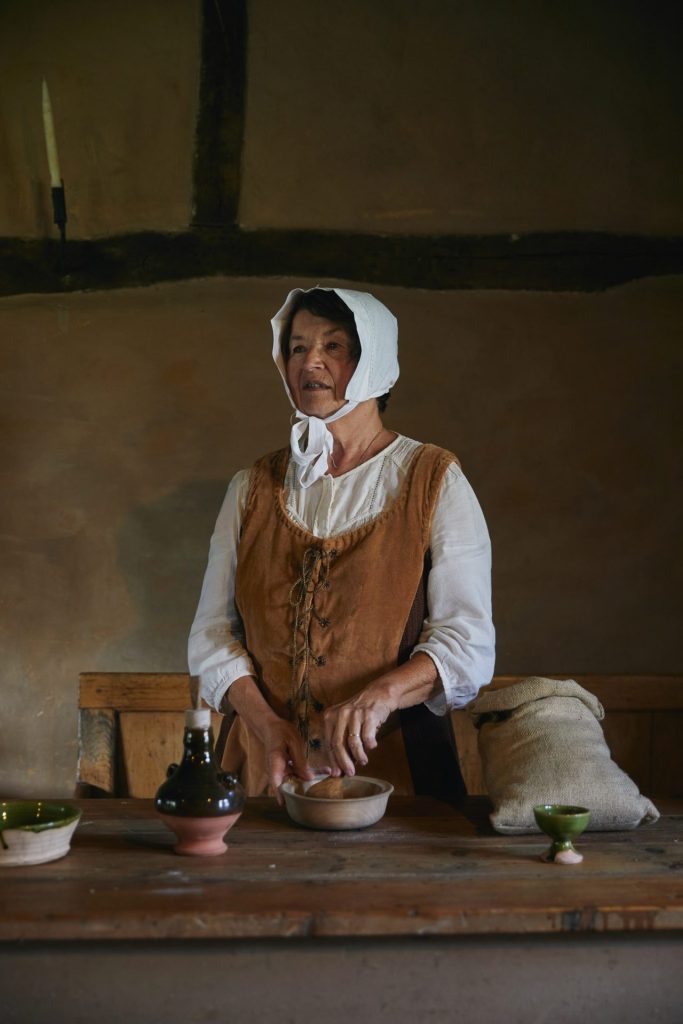 living history volunteer in Tudor costume at the Ryedale Folk Museum in the North York Moors National Park