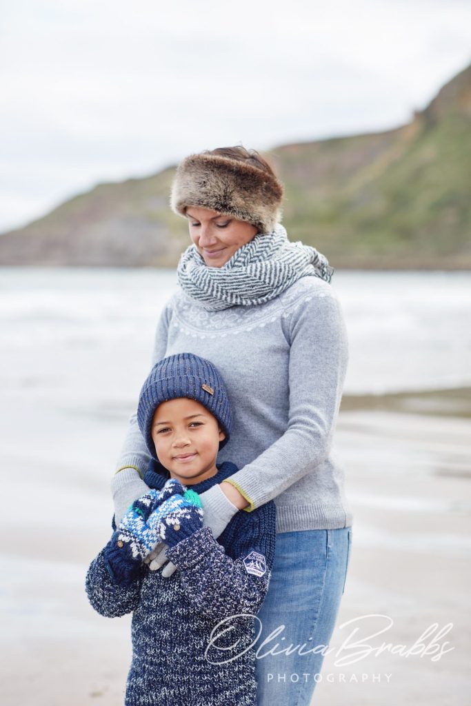 mother and son on yorkshire beach on Winter walk