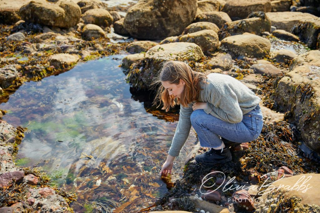woman foraging for seaweed on Yorkshire Coast