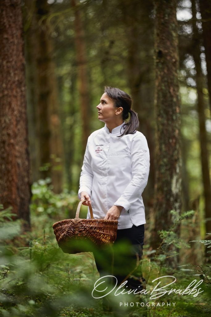 Michelin star chef Lorna McNee in woodland near Glasgow foraging for mushrooms