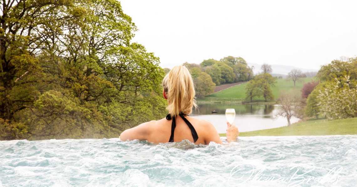 outdoor infinity pool with views of estate at the coniston hotel in north yorkshire